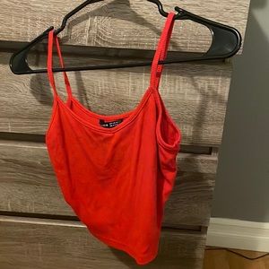 Red tank top, lined, thin, v-necked.